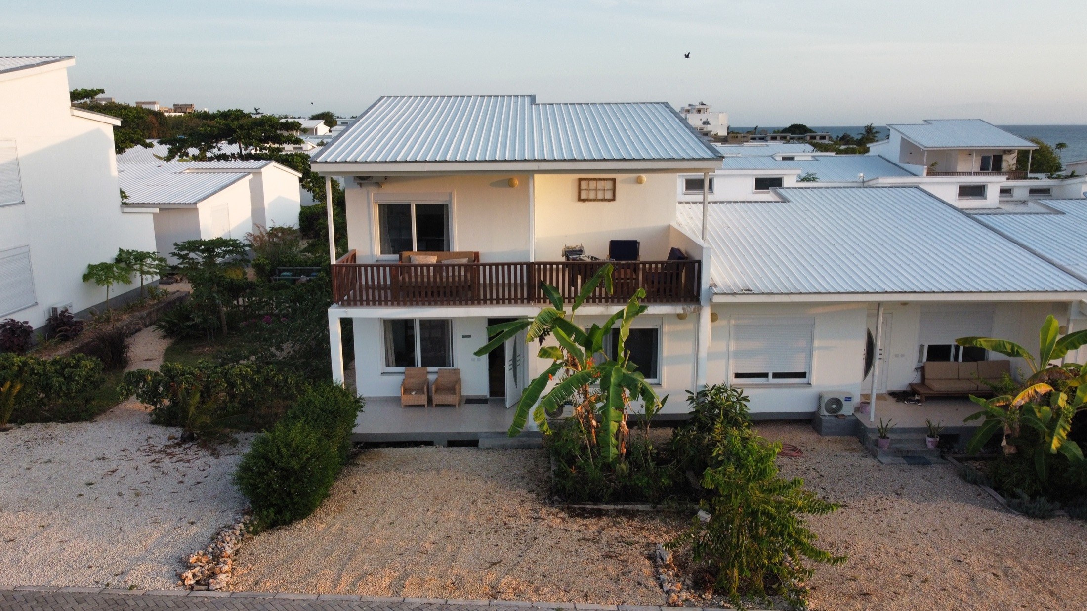 Aerial view of Oceanview House with veranda and tropical garden