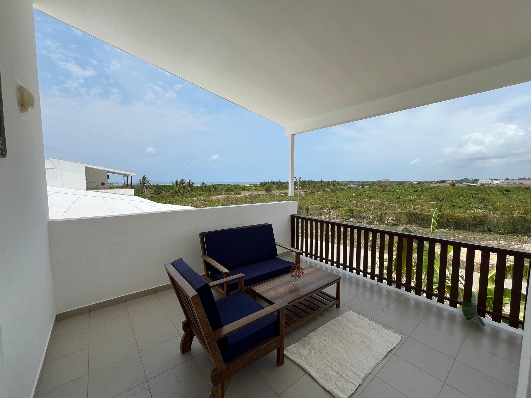 Large furnished veranda with wide green views